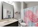 Bathroom with shower, vanity, and decorative accents at 210 Pine Valley Rd, Hiram, GA 30141