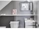 Small bathroom with sink, toilet, and floating shelf at 210 Pine Valley Rd, Hiram, GA 30141