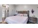 Spacious bedroom with king-size bed and light pink bedding at 210 Pine Valley Rd, Hiram, GA 30141