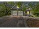 Long driveway leading to a two-car garage at 210 Pine Valley Rd, Hiram, GA 30141