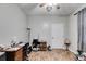 Home office with wood flooring and built-in shelving at 210 Pine Valley Rd, Hiram, GA 30141