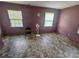 Empty bedroom with mauve walls and tile flooring at 8347 Hilltop Rd, Jonesboro, GA 30236