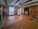 Large basement recreation room with wood paneling and fireplace at 8347 Hilltop Rd, Jonesboro, GA 30236