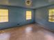 Simple bedroom with light blue walls and tile flooring at 8347 Hilltop Rd, Jonesboro, GA 30236