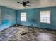 Empty bedroom with light blue walls and wood-look flooring at 8347 Hilltop Rd, Jonesboro, GA 30236