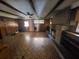 Finished basement featuring a brick fireplace and wood flooring at 8347 Hilltop Rd, Jonesboro, GA 30236