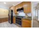 Kitchen features stainless steel appliances and light wood cabinets at 1735 Peachtree Ne St # 321, Atlanta, GA 30309