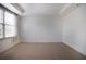 Spacious carpeted bedroom with large window and neutral walls at 1735 Peachtree Ne St # 321, Atlanta, GA 30309