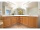 Double vanity bathroom with ample storage and neutral tile at 1735 Peachtree Ne St # 321, Atlanta, GA 30309