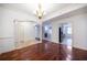Open dining room with hardwood floors, and views into living room and kitchen at 1735 Peachtree Ne St # 321, Atlanta, GA 30309
