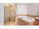 Spa-like bathroom with corner soaking tub and walk-in shower at 1735 Peachtree Ne St # 321, Atlanta, GA 30309
