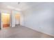 Well-lit bedroom with carpet, large closet, and access to a hallway at 1735 Peachtree Ne St # 321, Atlanta, GA 30309
