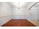 Bright dining room with hardwood floors and elegant chandelier at 1735 Peachtree Ne St # 321, Atlanta, GA 30309
