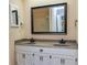 Bathroom with double vanity and a large mirror at 13819 Woolsey Rd, Hampton, GA 30228