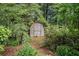 Wooden storage shed nestled in the backyard at 310 Conyers Rd, Mcdonough, GA 30253