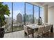 Bright dining area with floor to ceiling windows and city views at 40 12Th Ne St # 1903, Atlanta, GA 30309