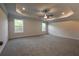 Large main bedroom with carpet, ceiling fan and multiple windows at 1189 Red Oak Blvd, Loganville, GA 30052