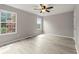 Spacious bedroom featuring wood-look vinyl flooring and large windows at 3419 River Run Trl, Decatur, GA 30034