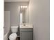Clean bathroom with gray vanity, toilet and a bathtub at 3419 River Run Trl, Decatur, GA 30034