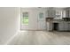 Eat-in kitchen with gray cabinets and vinyl flooring at 3419 River Run Trl, Decatur, GA 30034