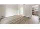 Bright living room with vinyl plank flooring and access to kitchen at 3419 River Run Trl, Decatur, GA 30034