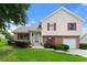 Two-story house with red shutters and attached garage at 3419 River Run Trl, Decatur, GA 30034