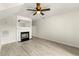 Living room with fireplace and wood-look vinyl flooring at 3419 River Run Trl, Decatur, GA 30034