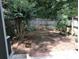 Simple backyard with grass and wooden fence at 5632 Stonington Trace Pkwy, Stone Mountain, GA 30087