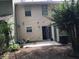 Backyard view of home with patio and landscaping at 5632 Stonington Trace Pkwy, Stone Mountain, GA 30087