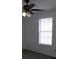 Bright bedroom with ceiling fan and large window at 5632 Stonington Trace Pkwy, Stone Mountain, GA 30087