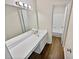 Bathroom with double vanity and white cabinets at 502 Brandywine Cir, Atlanta, GA 30350