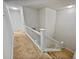 Stairwell with carpeted flooring and white railings at 502 Brandywine Cir, Atlanta, GA 30350