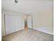 Bedroom with sliding door closet and neutral carpeting at 502 Brandywine Cir, Atlanta, GA 30350