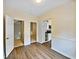 Dining area with wood-look floors and access to kitchen at 502 Brandywine Cir, Atlanta, GA 30350