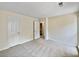 Bedroom with neutral carpeting and door to bathroom at 502 Brandywine Cir, Atlanta, GA 30350