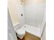 Bathroom with white subway tile shower and vinyl flooring at 502 Brandywine Cir, Atlanta, GA 30350