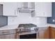 Modern kitchen features stainless steel range and oven, and white subway tile backsplash at 775 Juniper Ne St # 612, Atlanta, GA 30308