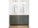 Modern bathroom featuring a double vanity with a gray cabinet and gold accents at 589 Federal Se Ter, Atlanta, GA 30315