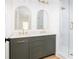 Elegant bathroom with a double vanity, arched mirrors, and a walk-in shower at 589 Federal Se Ter, Atlanta, GA 30315