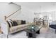 Open living room with beige sofa and a view of the dining area at 589 Federal Se Ter, Atlanta, GA 30315