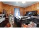 Primary bedroom with a large bed and wood paneling at 3542 Lynfield Sw Dr, Atlanta, GA 30311