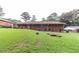 Large backyard with grassy area and landscaping at 3542 Lynfield Sw Dr, Atlanta, GA 30311