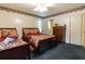 Spacious bedroom with two double beds and a dresser at 3542 Lynfield Sw Dr, Atlanta, GA 30311