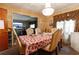 Dining room with chandelier, table set for a meal, and window curtains at 3542 Lynfield Sw Dr, Atlanta, GA 30311