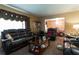 Living room with leather furniture, coffee table, and window treatments at 3542 Lynfield Sw Dr, Atlanta, GA 30311