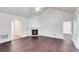 Living room with a corner fireplace and hardwood floors at 5501 Somer Ridge Ct, Douglasville, GA 30134