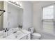 Clean bathroom with single sink vanity, shower, and toilet at 5501 Somer Ridge Ct, Douglasville, GA 30134