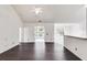 Spacious living room with dark hardwood floors and high ceilings at 5501 Somer Ridge Ct, Douglasville, GA 30134