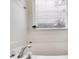Clean bathroom with a white bathtub and window at 5501 Somer Ridge Ct, Douglasville, GA 30134