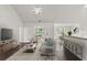 Open living space with hardwood floors, a cozy sitting area and breakfast bar at 5501 Somer Ridge Ct, Douglasville, GA 30134